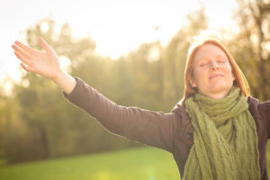 Young woman feeling relief and gratitude after ketamine treatment for depression, showing there's no place for the stigmatizing term: mentally ill.