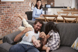 Dad playing with kids after ketamine treatment. Does depression run families?