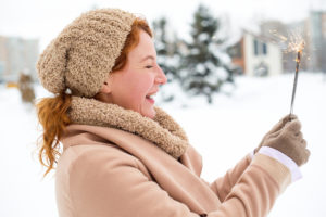 This happy lady in the snow knows that ketamine treatment erases suicidal thoughts.