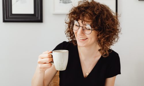 Lady enjoying flavonoids in her green tea.